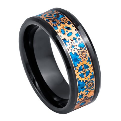Ring with black band and blue and gold geometric design on a white background