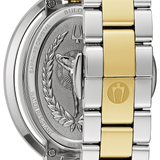 A close-up studio shot of a Bulgari watch showing the polished silver-toned case back with an engraved eagle and laurel design, paired with a two-tone metal link bracelet featuring alternating silver and yellow gold links.