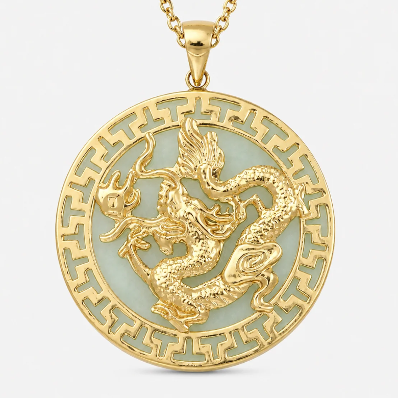 A gold pendant necklace featuring a raised dragon motif over a pale green inlay, surrounded by a decorative gold border, shown on a light gray background.