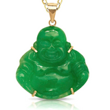 A green jade Buddha pendant on a gold chain, shown against a white background with a soft reflection.